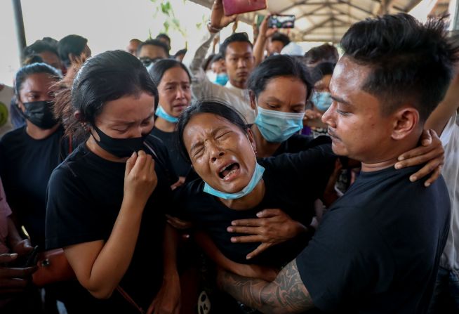 Thida Hnin cries during the funeral of her husband, Thet Naing Win, in Mandalay on February 23. He and another protester <a href="index.php?page=&url=https%3A%2F%2Fwww.cnn.com%2F2021%2F02%2F20%2Fasia%2Fmyanmar-police-protestors-reports-shooting-intl%2Findex.html" target="_blank">were fatally shot by security forces</a> during an anti-coup protest.