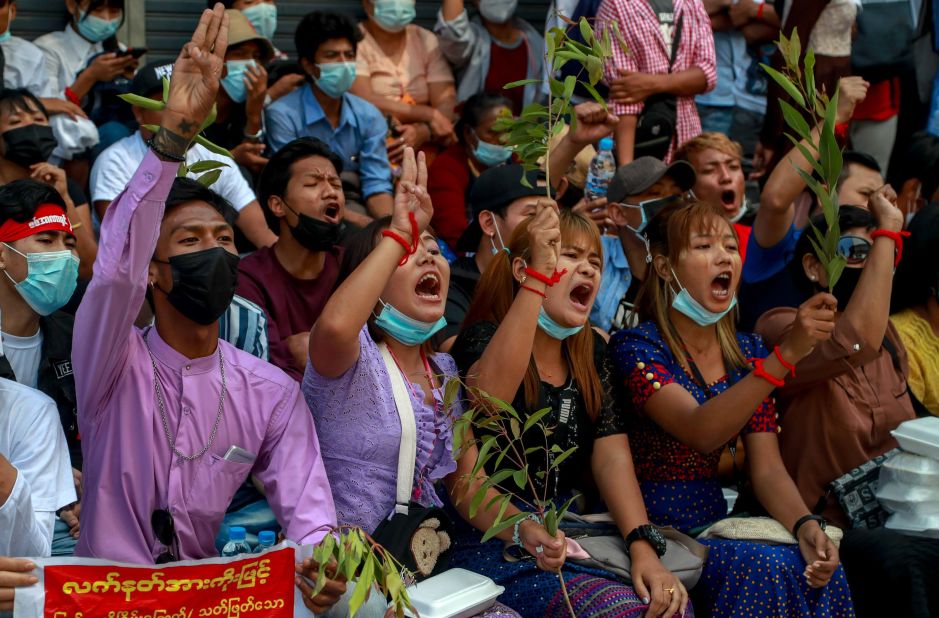 Anti-coup protesters shout slogans in Yangon on February 25.