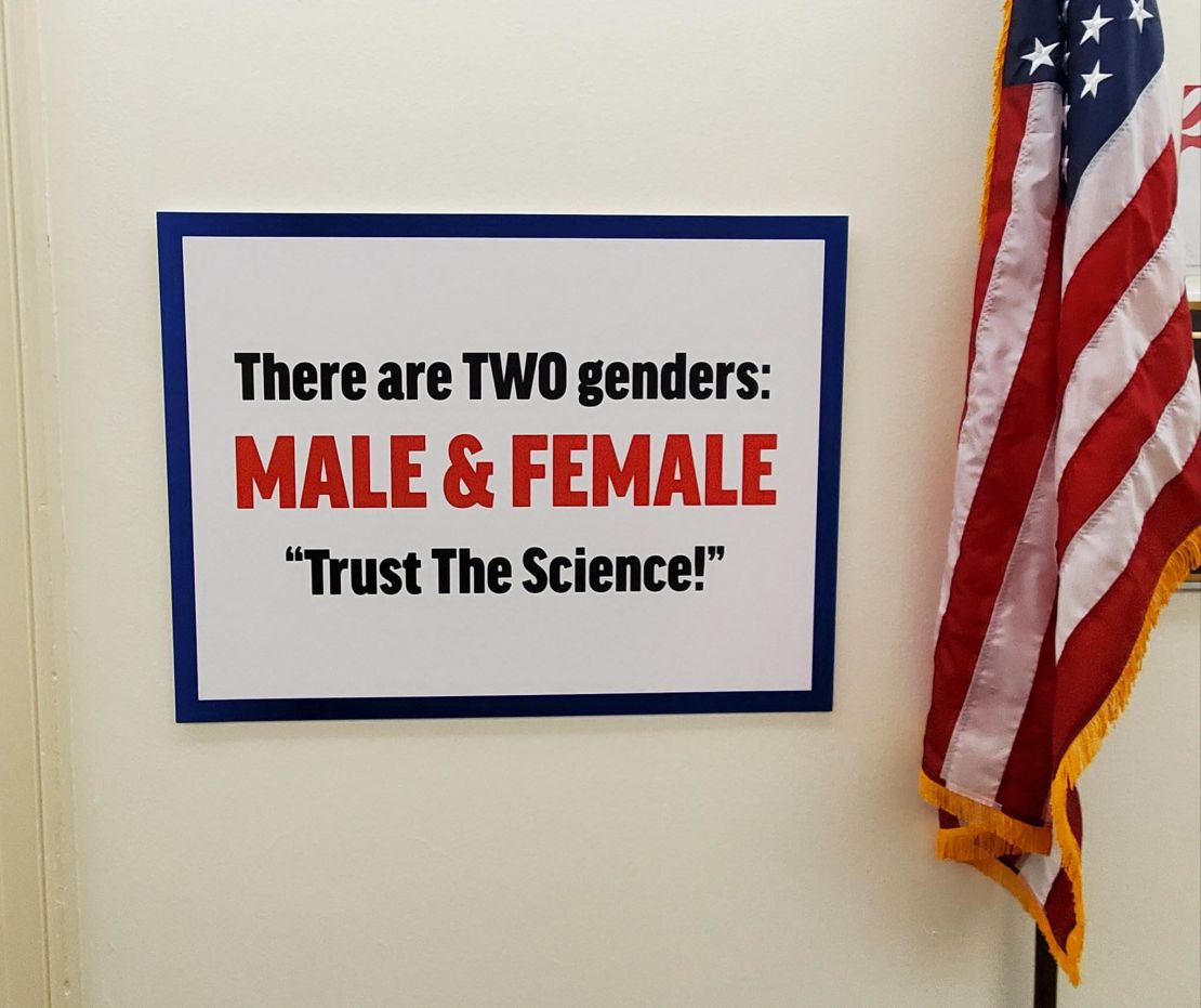 Rep. Marjorie Taylor Greene is facing sharp criticism after she posted an anti-transgender sign outside of her office, directly across the hall from another lawmaker who has a transgender child.