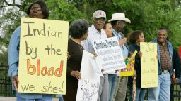 Waynetta Lawrie, left, of Tulsa, Okla., stands with others at the state Capitol in Oklahoma City, Tuesday, March 27, 2007, during a demonstration by several Cherokee Freedmen and their supporters. (AP Photo)