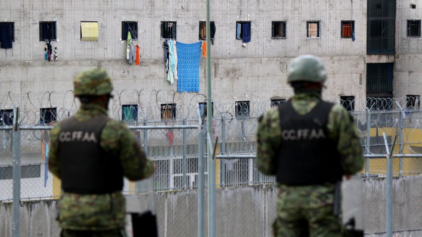 Soldiers stand guard outside the CRS Turi prison in Cuenca, Ecuador on February 24, 2021. - At least 79 inmates died in simultaneous riots blamed on gang warfare at four prisons in Ecuador, officials said Wednesday. (Photo by FERNANDO MACHADO / AFP) (Photo by FERNANDO MACHADO/AFP via Getty Images)