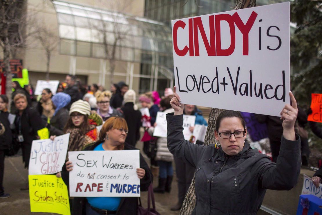 Protesters hold signs in support of Cindy Gladue outside Edmonton's city hall on April 2, 2015. 