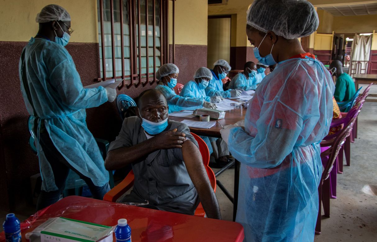 A hospital staff member lifts his shirt sleeve as he prepares to get an Ebola vaccine in N'Zerekore, Guinea, on Wednesday, February 24. The West African nation <a href="https://www.cnn.com/2021/02/15/africa/ebola-guinea-west-africa-intl/index.html" target="_blank">declared an Ebola outbreak in one of its regions</a> earlier this month.