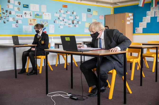 British Prime Minister Boris Johnson takes part in an online class as he visits the Sedgehill School in London on Tuesday, February 23.