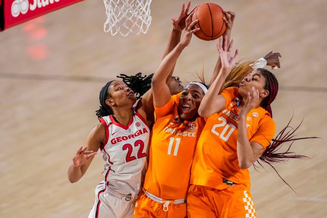Georgia's Malury Bates, left, competes for a rebound with Tennessee's Kasiyahna Kushkituah, center, and Tamari Key during a college basketball game on Sunday, February 21.