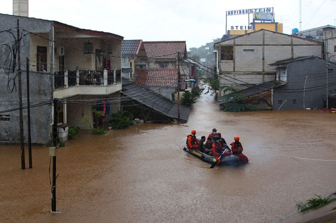 Rescue personnel paddle a raft through a flood-affected neighborhood in Jakarta, Indonesia, on Saturday, February 20.