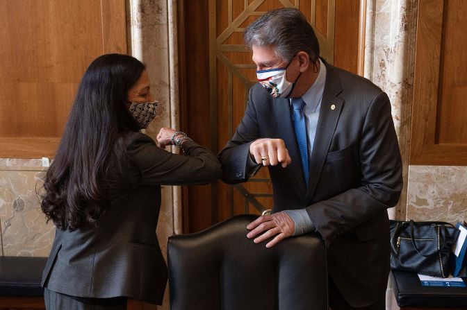 US Sen. Joe Manchin greets US Rep. Deb Haaland, President Joe Biden's nominee for interior secretary, at her confirmation hearings on Tuesday, February 23. Manchin, a key moderate Democrat who is chairman of the Energy and Natural Resources Committee, later announced that he would vote to confirm Haaland, <a href="https://www.cnn.com/2021/02/24/politics/haaland-senate-confirmation-hearing-day-two/index.html" target="_blank">giving her nomination a boost.</a> If confirmed by the Senate, she would be the first Native American Cabinet secretary.