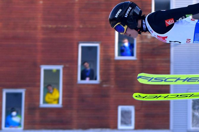 People watch French ski jumper Valentin Foubert compete at a World Cup event in Rasnov, Romania, on Friday, February 19.