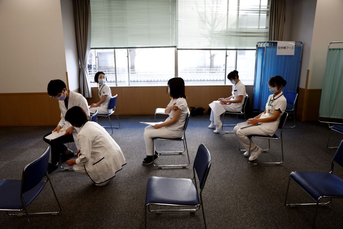 Medical workers wait for consultations after receiving a dose of the Covid-19 vaccine in Tokyo on February 17, 2021.