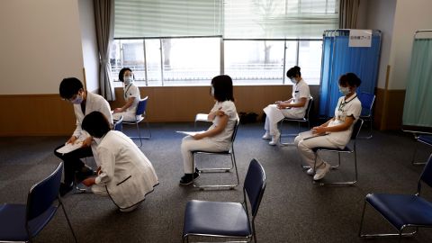 Medical workers wait for consultations after receiving a dose of the Covid-19 vaccine in Tokyo on February 17, 2021.
