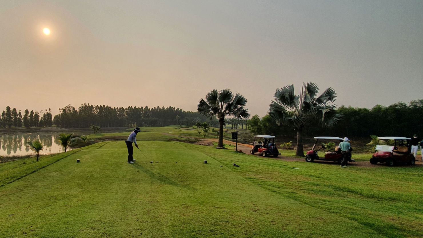 A man, who is among the first group of South Korean tourists to arrive in Thailand under a "golf quarantine" programme amid the coronavirus disease (COVID-19) pandemic, plays golf during his 15-day quarantine at the Artitaya Country Club in Nakhon Nayok, Thailand February 25, 2021. Heo Kwang-eum / Handout via REUTERS ATTENTION EDITORS - THIS IMAGE WAS PROVIDED BY A THIRD PARTY. NO RESALES. NO ARCHIVE.