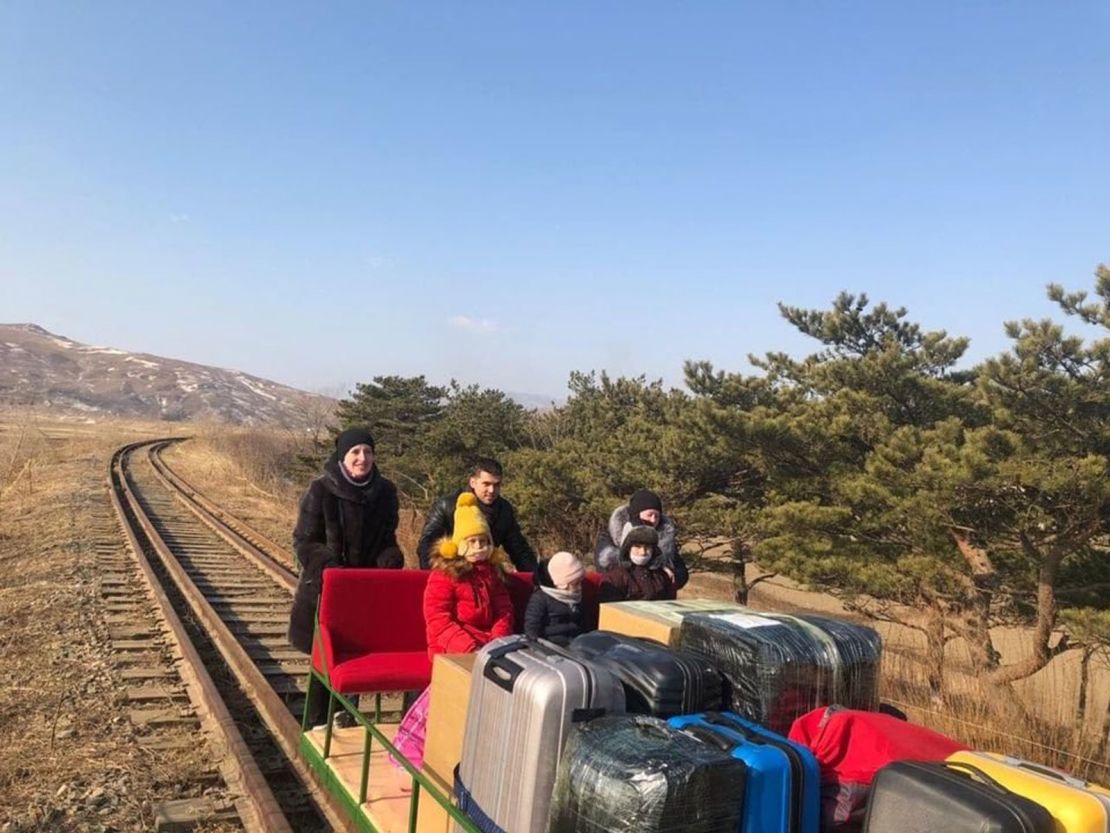 Russian diplomats working in the Pyongyang embassy had to use a handcar as they returned home from North Korea with their family members.