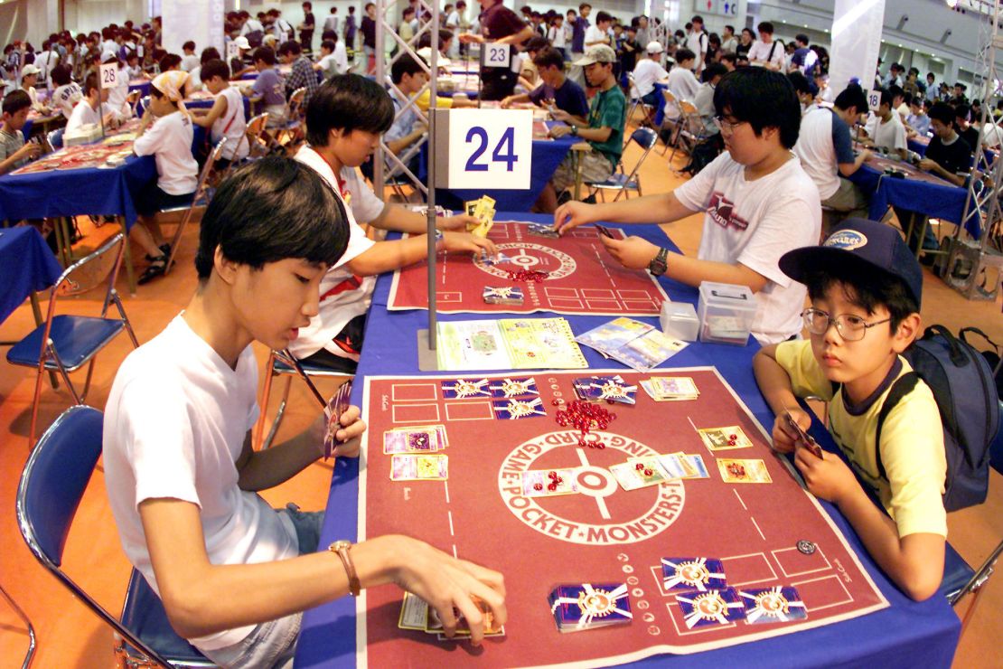 Japanese children participate in a Pokémon card game tournament in 1999. 