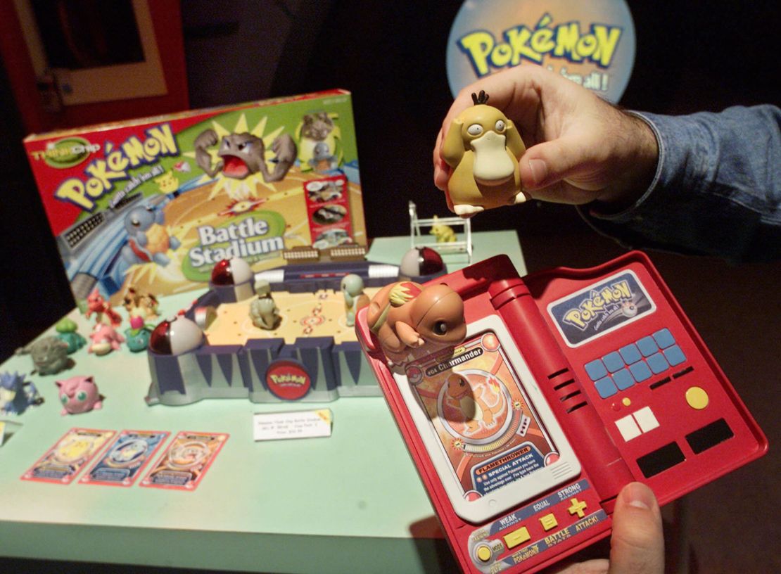 A Hasbro employee shows off components of the Pokemon Battle Stadium at the company's showroom in New York in February 2000.