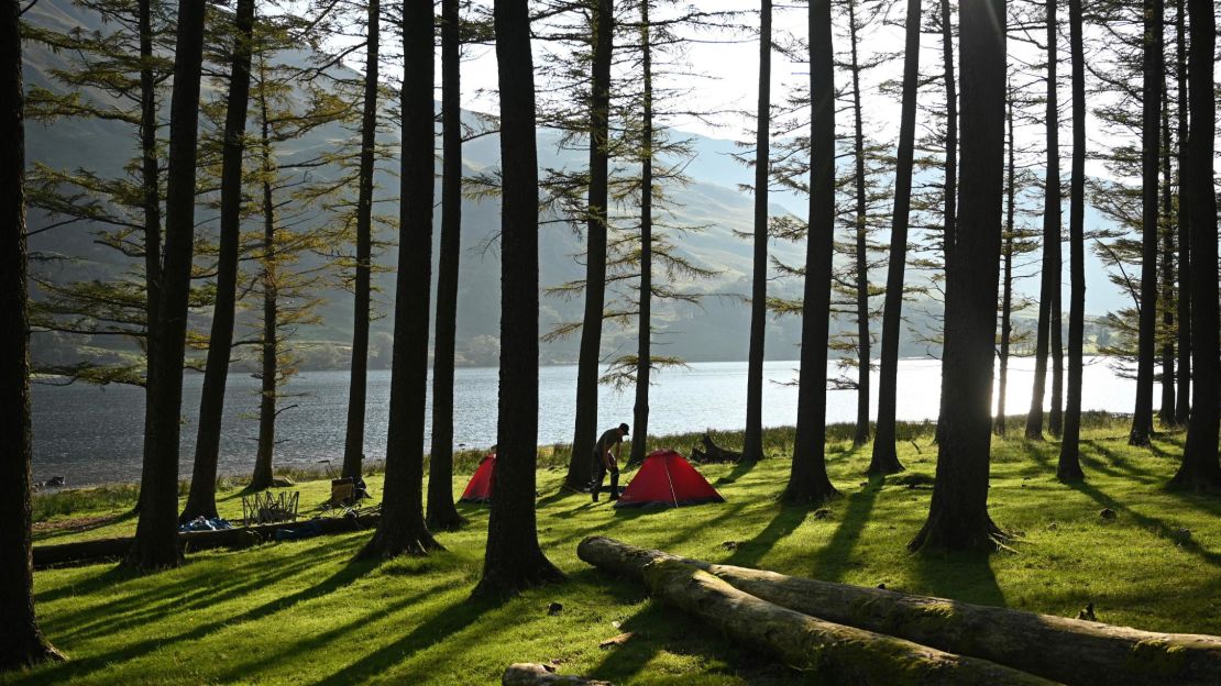 Campers in Buttermere Lake in England's Lake District in August 2020.