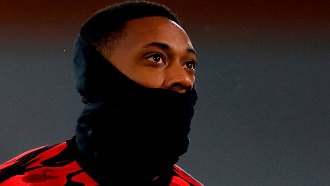 Manchester United's French striker Anthony Martial warms up for the English Premier League football match between Fulham and Manchester United at Craven Cottage in London on January 20, 2021. (Photo by Adrian DENNIS / POOL / AFP) / RESTRICTED TO EDITORIAL USE. No use with unauthorized audio, video, data, fixture lists, club/league logos or 'live' services. Online in-match use limited to 120 images. An additional 40 images may be used in extra time. No video emulation. Social media in-match use limited to 120 images. An additional 40 images may be used in extra time. No use in betting publications, games or single club/league/player publications. /  (Photo by ADRIAN DENNIS/POOL/AFP via Getty Images)