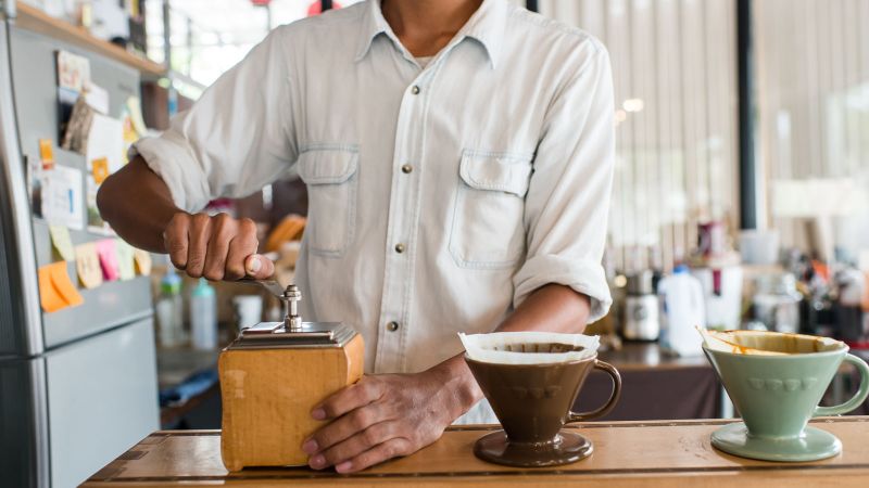 Manual coffee grinder outlet target