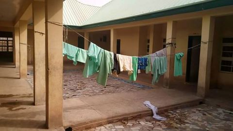 School uniforms still hung inside the deserted school dormitory following the attack 