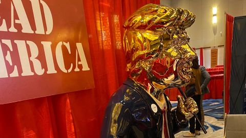 A golden Trump statue is displayed at the 2021 Conservative Political Action Conference