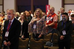 People listen to the national anthem during the opening of the Conservative Political Action Conference at the Hyatt Regency on February 26, 2021 in Orlando, Florida. 