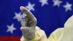 A health worker holds a vial of the Sputnik V vaccine against COVID-19, before the vaccination of staff members and workers of the Perez de Leon Hospital in Petare neighbourhood, in eastern Caracas, on February 19, 2021, amid the novel coronavirus pandemic. (Photo by Federico PARRA / AFP) (Photo by FEDERICO PARRA/AFP via Getty Images)