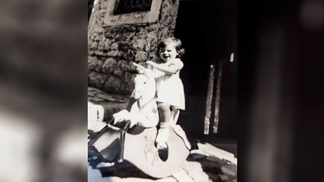 Faccini's sister pictured in front of their grandmother's old house.