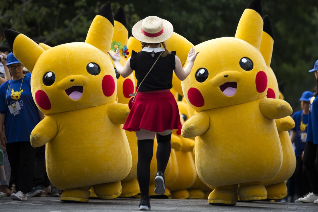 Performers dressed as Pikachu during a "Pikachu Outbreak" event hosted bin Yokohama, Japan, in 2018.