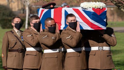 The coffin of Captain Sir Tom Moore is carried by members of the Armed Forces during his funeral at Bedford Crematorium Saturday