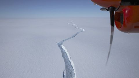 An airplane flies over the North Rift crack in the Brunt Ice Shelf in January.