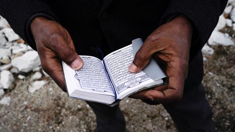 Yusuf Nur, the spiritual adviser for Dustin Higgs, holds a Quran while he talks about his experiences with Higgs, outside the United States Penitentiary in Terre Haute, Indiana, on January 15, 2021.
