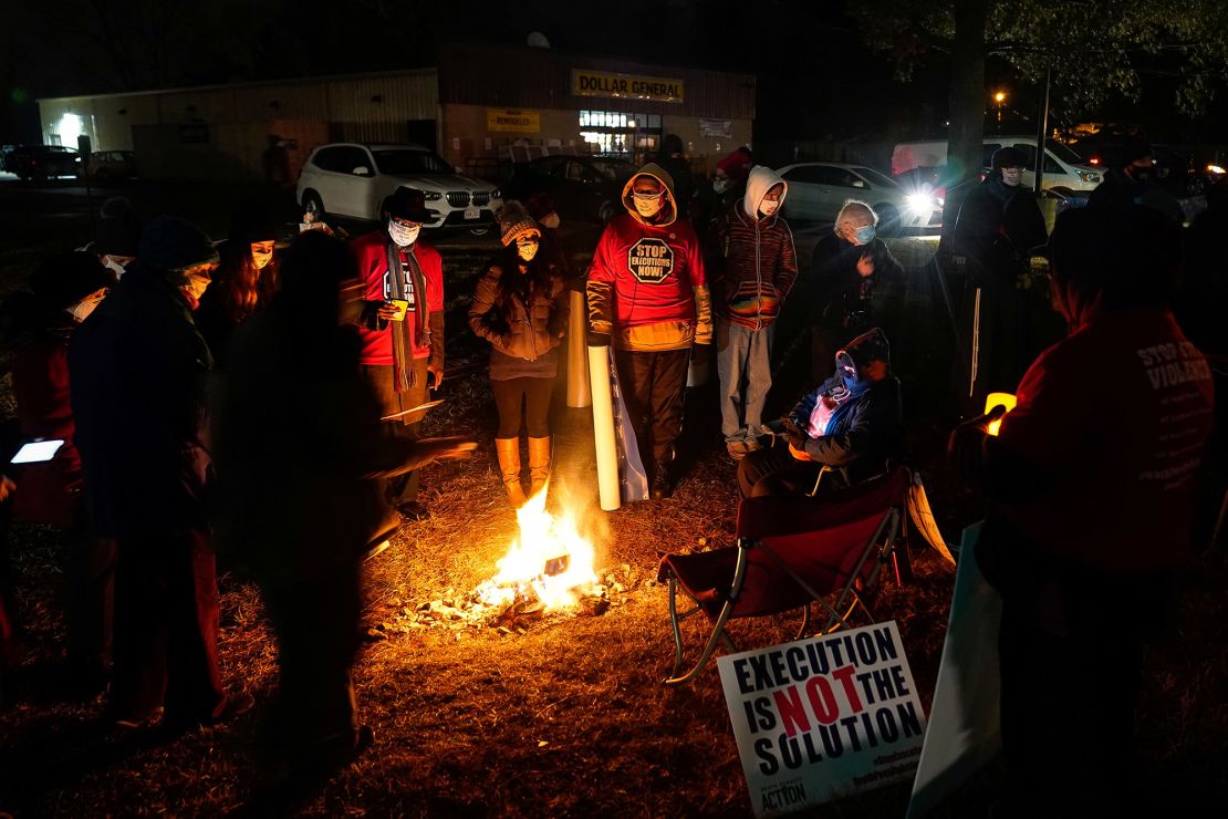 Anti-death penalty activists gather during a vigil outside the United States Penitentiary in Terre Haute, Indiana, on January 15, 2021. 