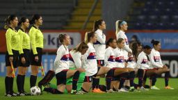 United States' players, most kneeling against racism, listen to their national anthem ahead of the women's friendly football match between the Netherlands and the United States of America (USA), at the Rat Verlegh Stadium in Breda, the Netherlands, on November 27, 2020. (Photo by Dean Mouhtaropoulos / POOL / AFP) / Netherlands OUT (Photo by DEAN MOUHTAROPOULOS/POOL/AFP via Getty Images)
