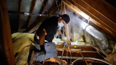 Plumber Randy Calazans with One Call Plumbing repairs a burst pipe in a home on February 21, 2021 in Houston, Texas.