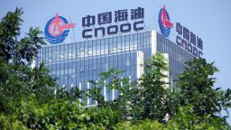 A signboard of CNOOC (China National Offshore Oil Corporation) is displayed on the rooftop of a building in Ji'nan city, east China's Shandong province.