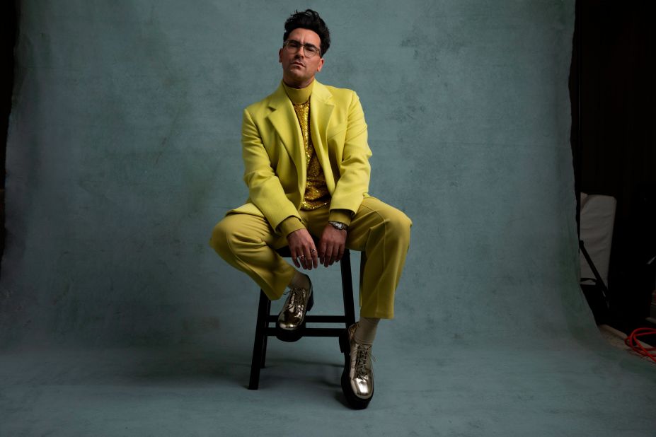 Dan Levy dazzled in a sunny Valentino suit, complete with sequin top and metallic boots, as shown in this photo taken by Lewis Mirrett.