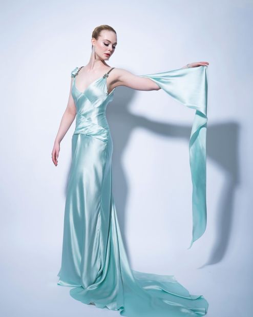 Elle Fanning oozed elegance in this icy, Grecian satin gown by Gucci.