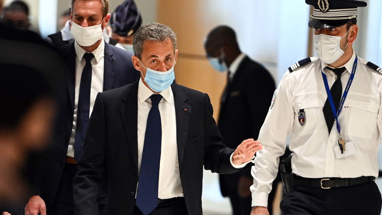 The former French president arrives to hear the final verdict in the corruption trial on Monday.