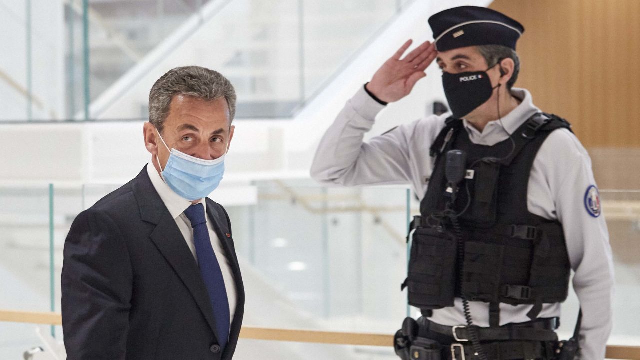 Former French President Nicolas Sarkozy leaves court after being found guilty of corruption and influence-peddling on March 1, 2021, in Paris.