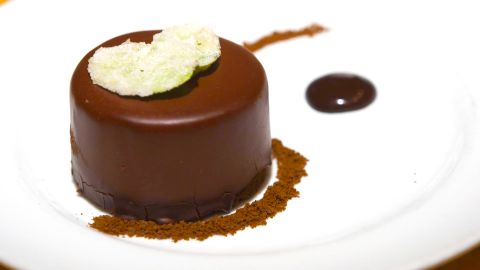 Eric Dale, executive pastry chef of Crafted Concepts, created the Thin Mint Mousse Tart served at Bistro Vendôme in Denver. (Photo by CNN)