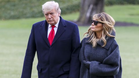 Then-President Donald Trump and First Lady Melania Trump walk on the South Lawn while returning to the White House on December 31, 2020 in Washington, DC.   (Photo by Tasos Katopodis/Getty Images)
