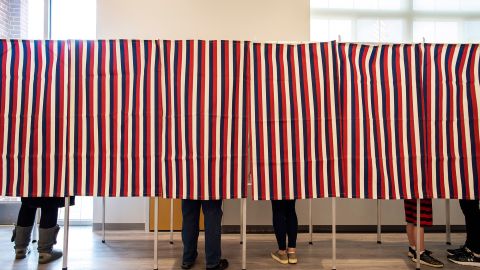 Voters fill in their ballots at polling booths in Concord, New Hampshire, on November 3, 2020. 