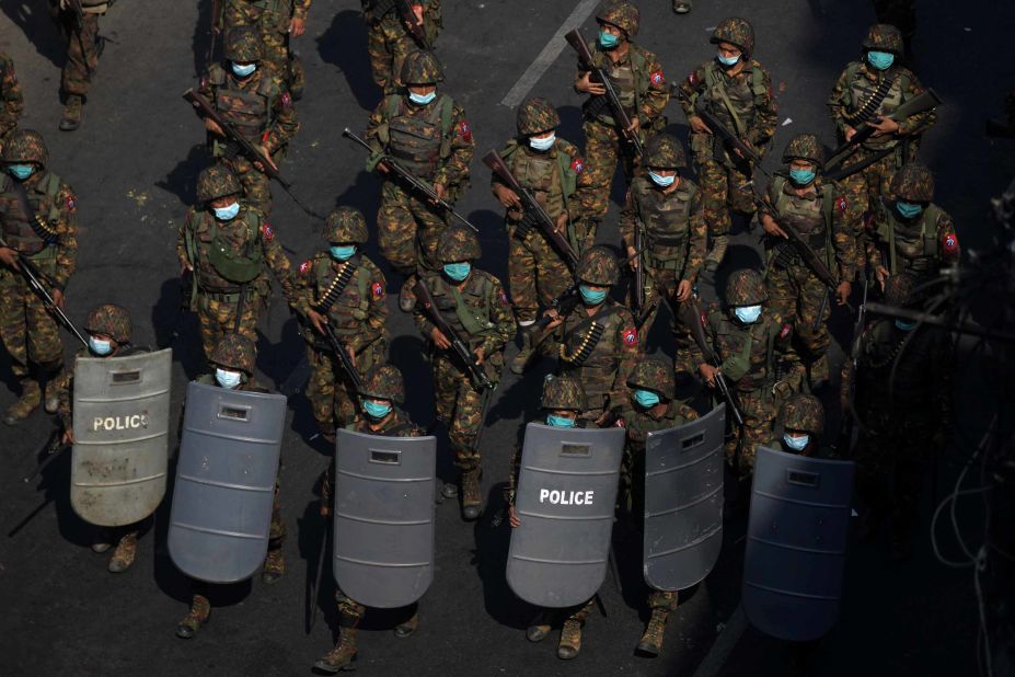 Soldiers patrol during a protest in Yangon on February 28.