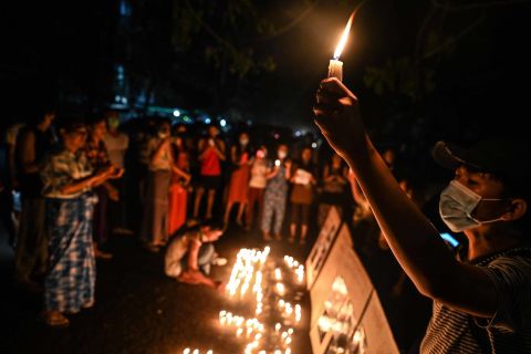 People in Yangon take part in a ceremony on February 28 to remember those who have been killed during demonstrations.