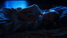 six years old child sleeping in bed at night, the blue moonlight light