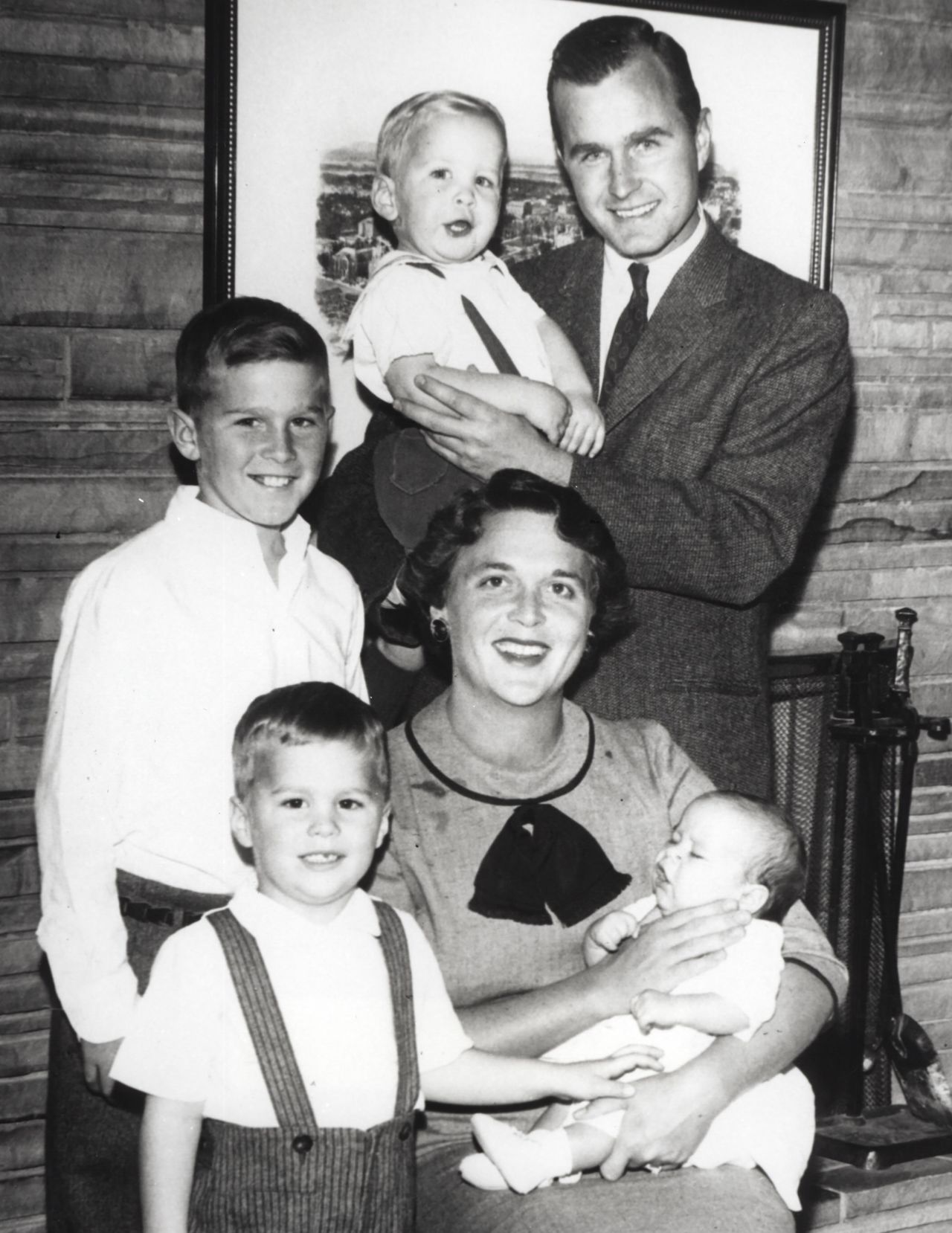 Bush, left, is the eldest child of George and Barbara Bush. Barbara is holding her youngest son, Marvin, and her husband is holding their son Neil. At bottom left is their son Jeb. The couple also had a young daughter, Robin, who died from leukemia in 1953.