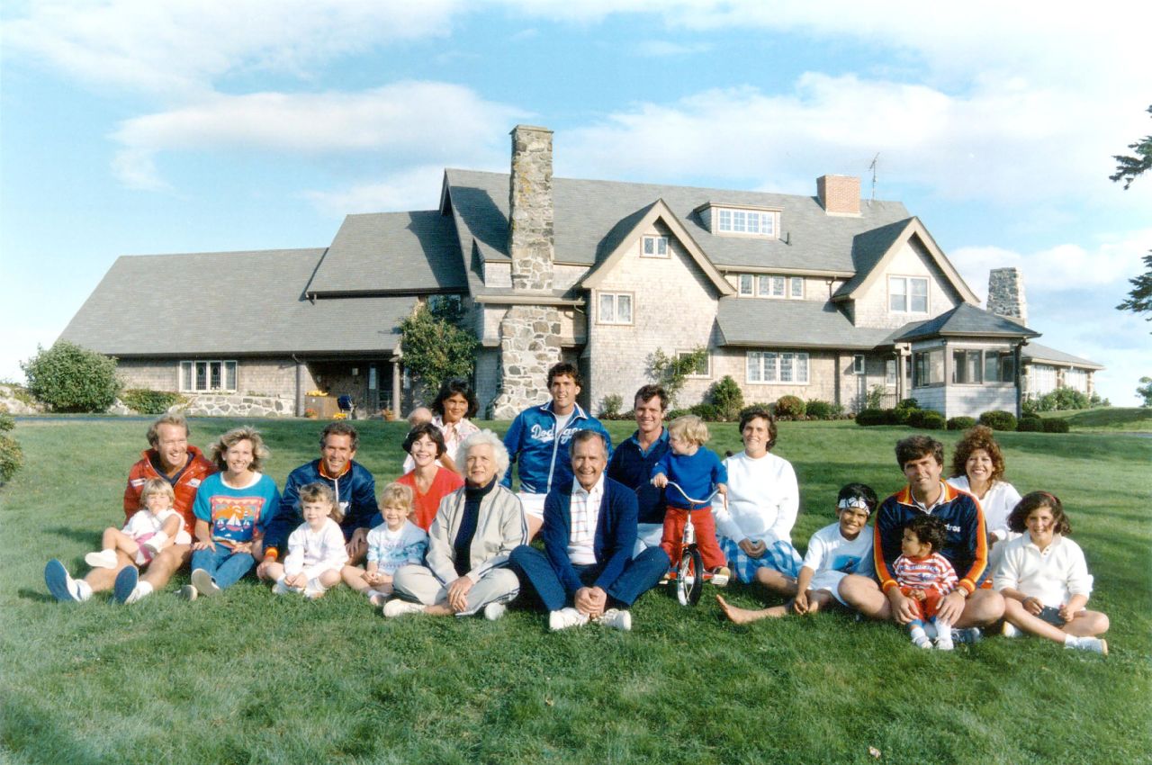 Members of the Bush family pose for a 1986 photo in Kennebunkport, Maine. George W. Bush is third from left behind his young daughter Barbara.