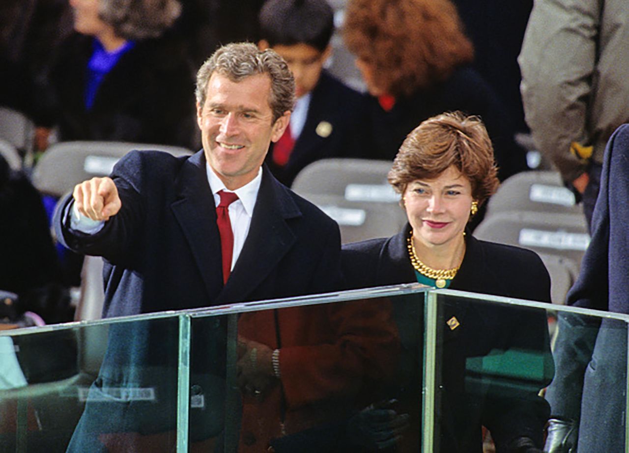 Bush and his wife, Laura, attend his father's inauguration in 1989. Bush worked on his father's presidential campaign.