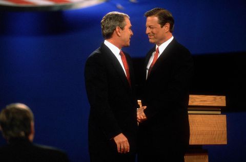 Bush shakes hands with his Democratic opponent, Vice President Al Gore, at their first presidential debate in October 2000.