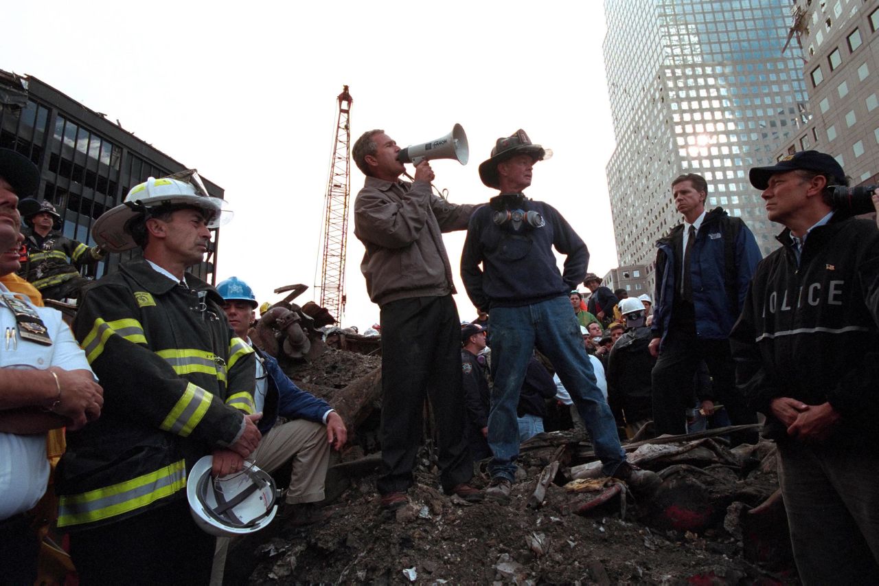 Bush speaks to rescue workers, firefighters and police officers at the rubble of New York's ground zero, three days after the September 11 attacks.