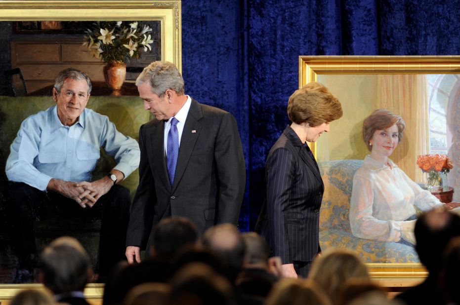 Bush and his wife, Laura, look over their portraits during their unveiling at the National Portrait Gallery in December 2008.